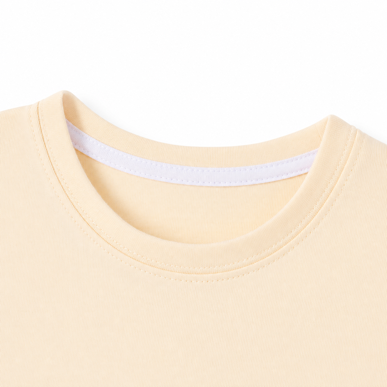 Close-up of the ivory crew neckline on the girls unicorn T-shirt.