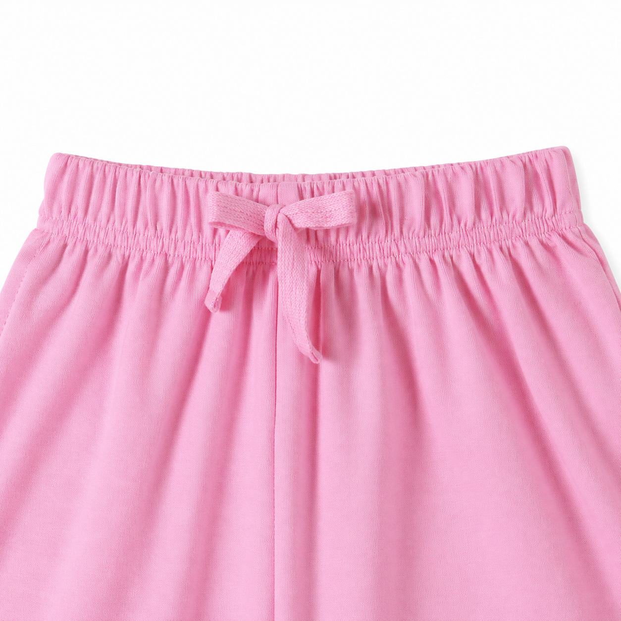 Close-up of the pink shorts elastic waistband and drawstring detail.