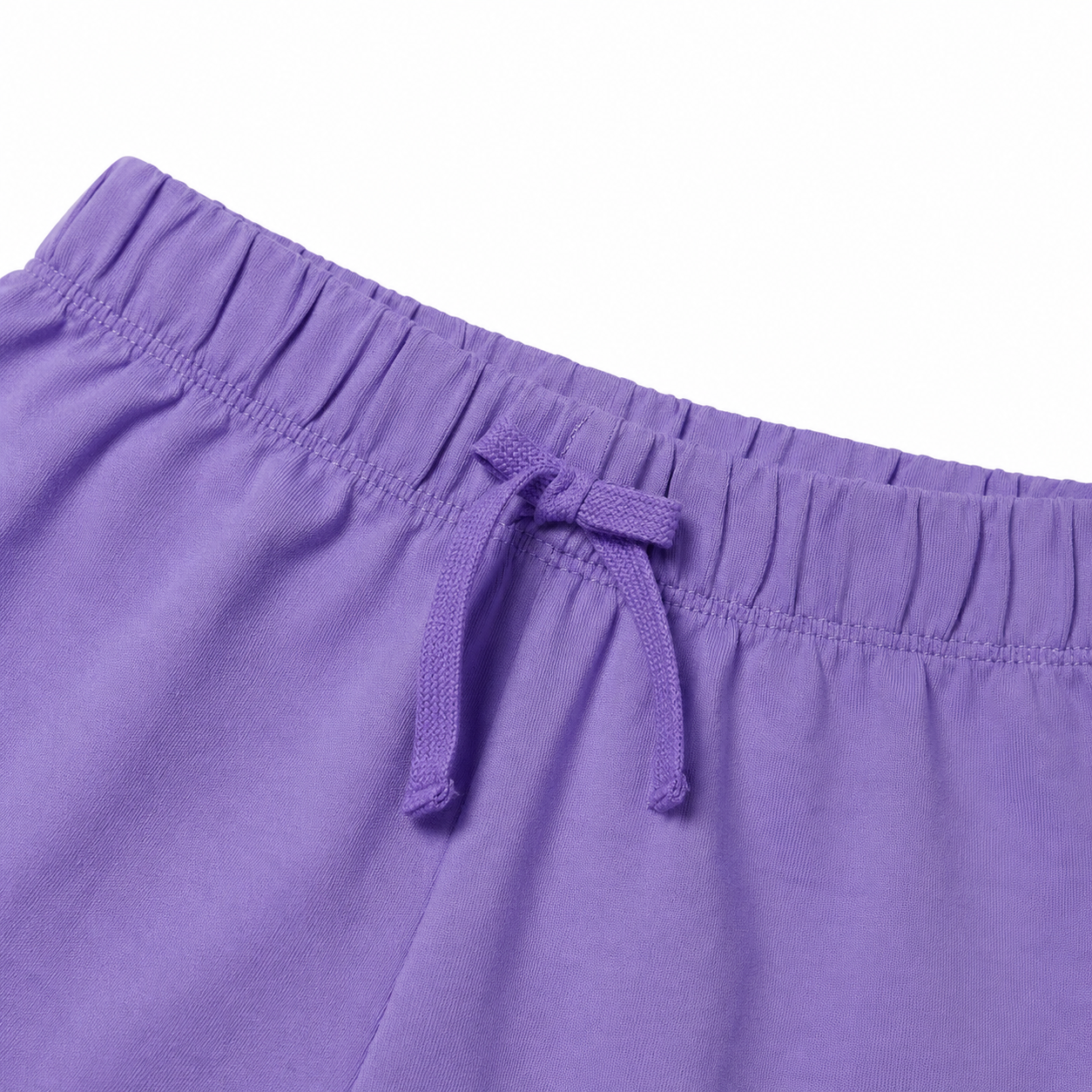 Close-up of the purple shorts elastic waistband and drawstring detail.