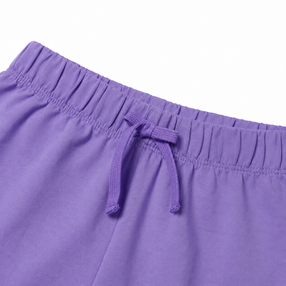 Close-up of the purple shorts elastic waistband and drawstring detail.