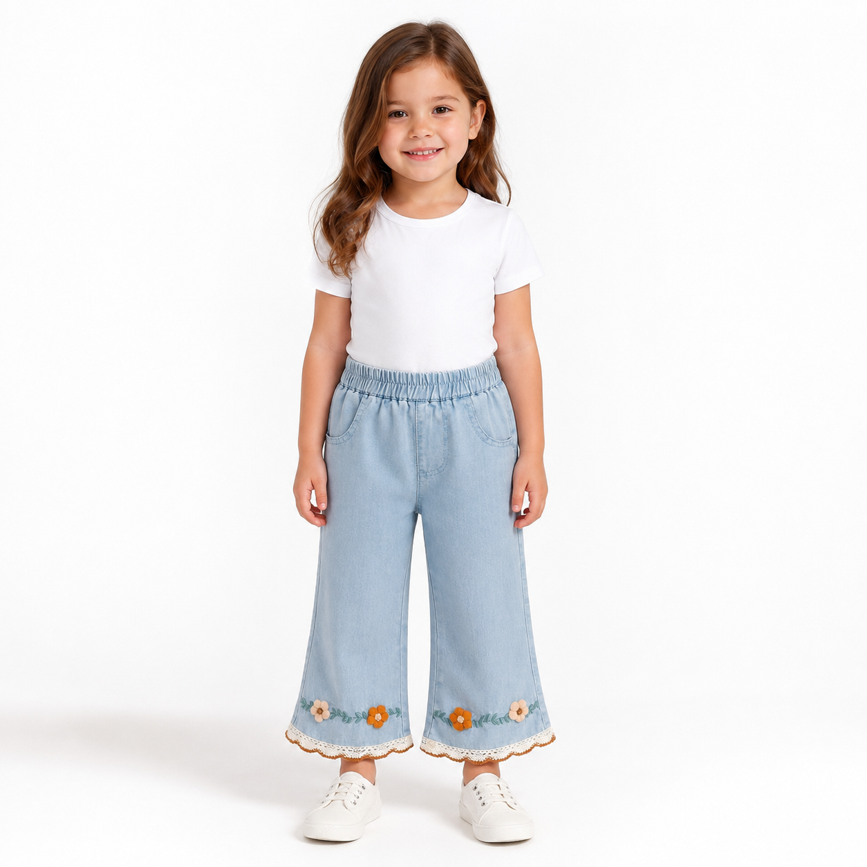 Girl model wearing light blue embroidered cropped jeans with floral lace hem details.