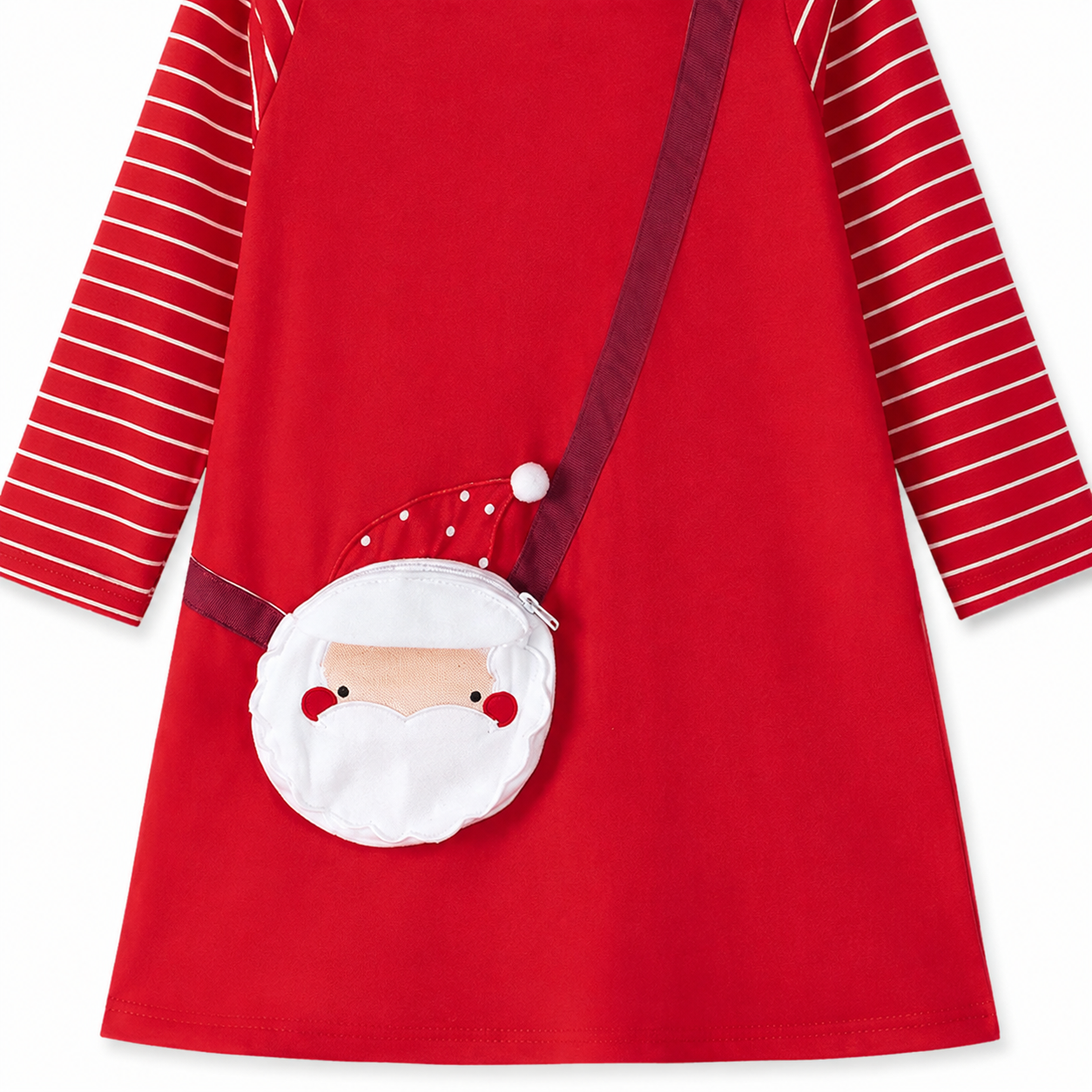 Close-up of the Santa Claus applique detail on the girls Christmas dress.