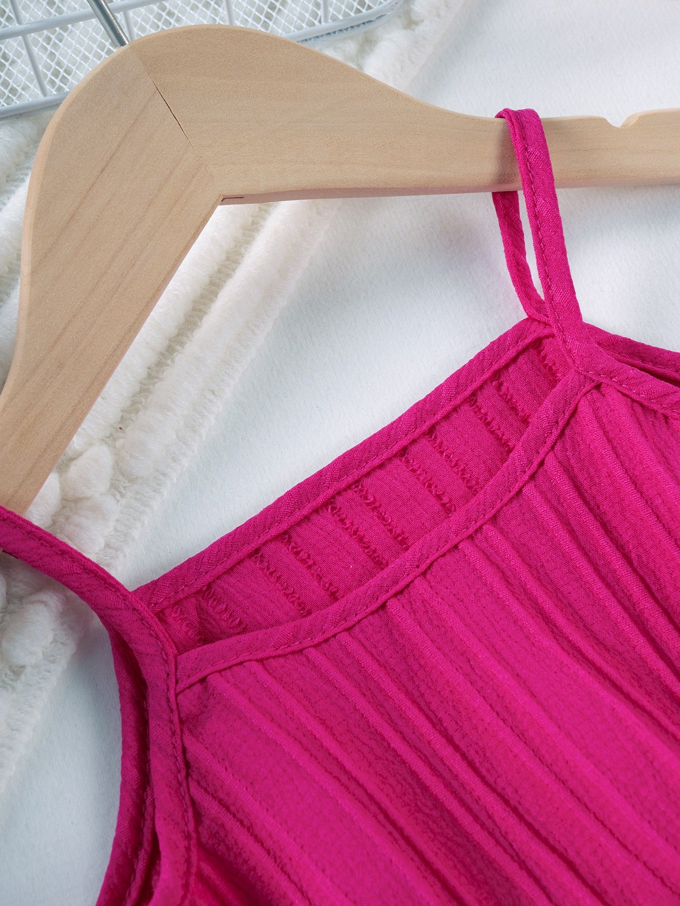 Strap and neckline detail on Mila Breeze fuchsia pink ruffle cami top