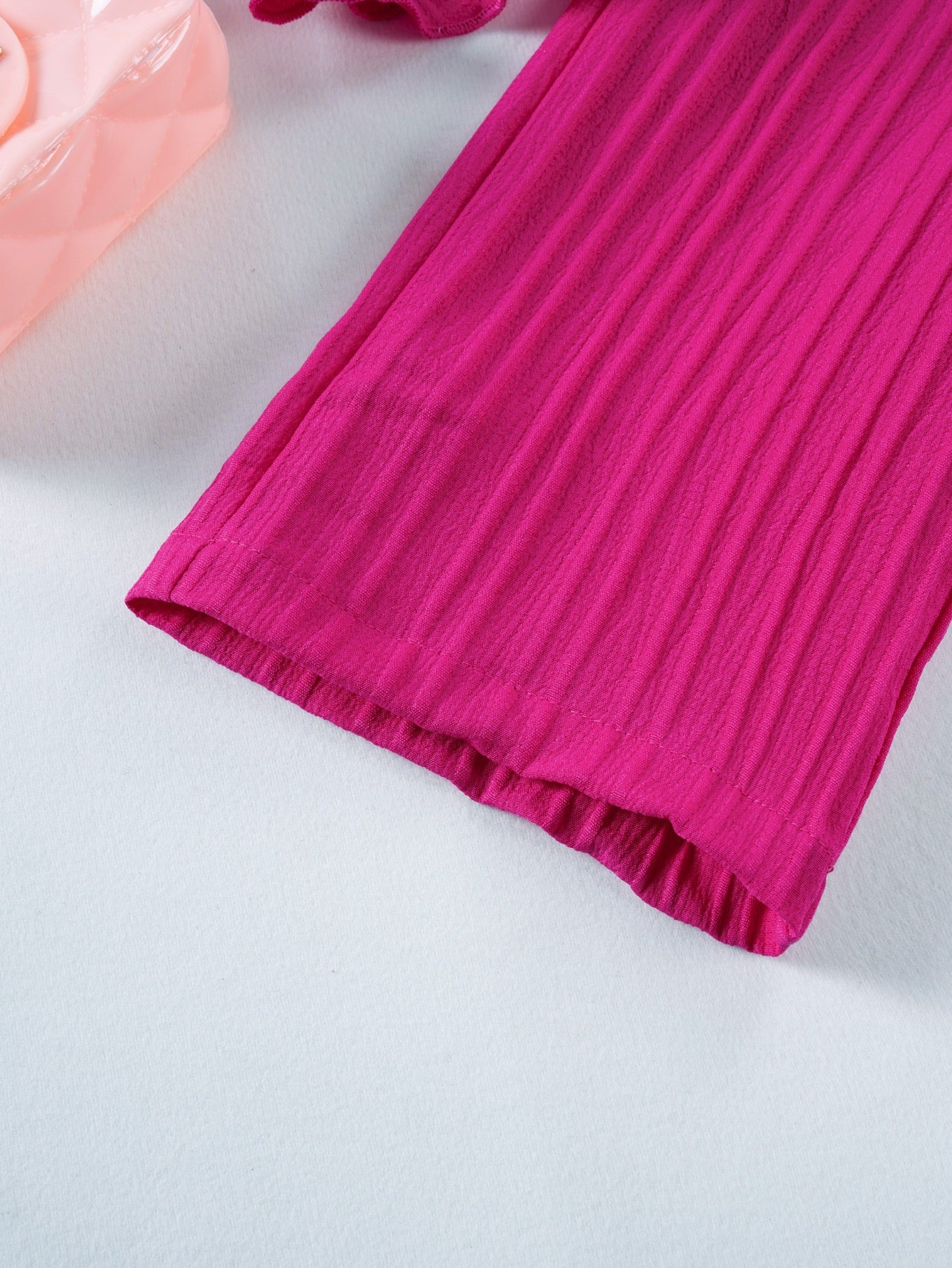 Hem detail on Mila Breeze fuchsia pink toddler girls wide-leg pants