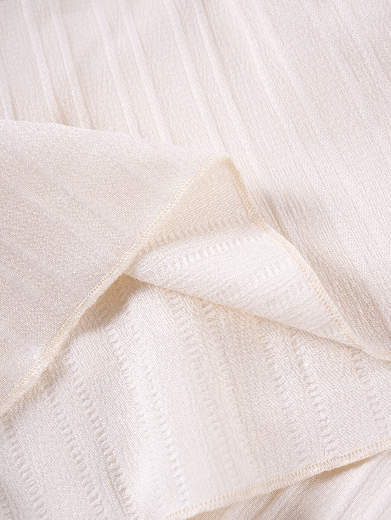 Ribbed fabric detail on Mila Breeze ivory cream toddler girls two-piece set