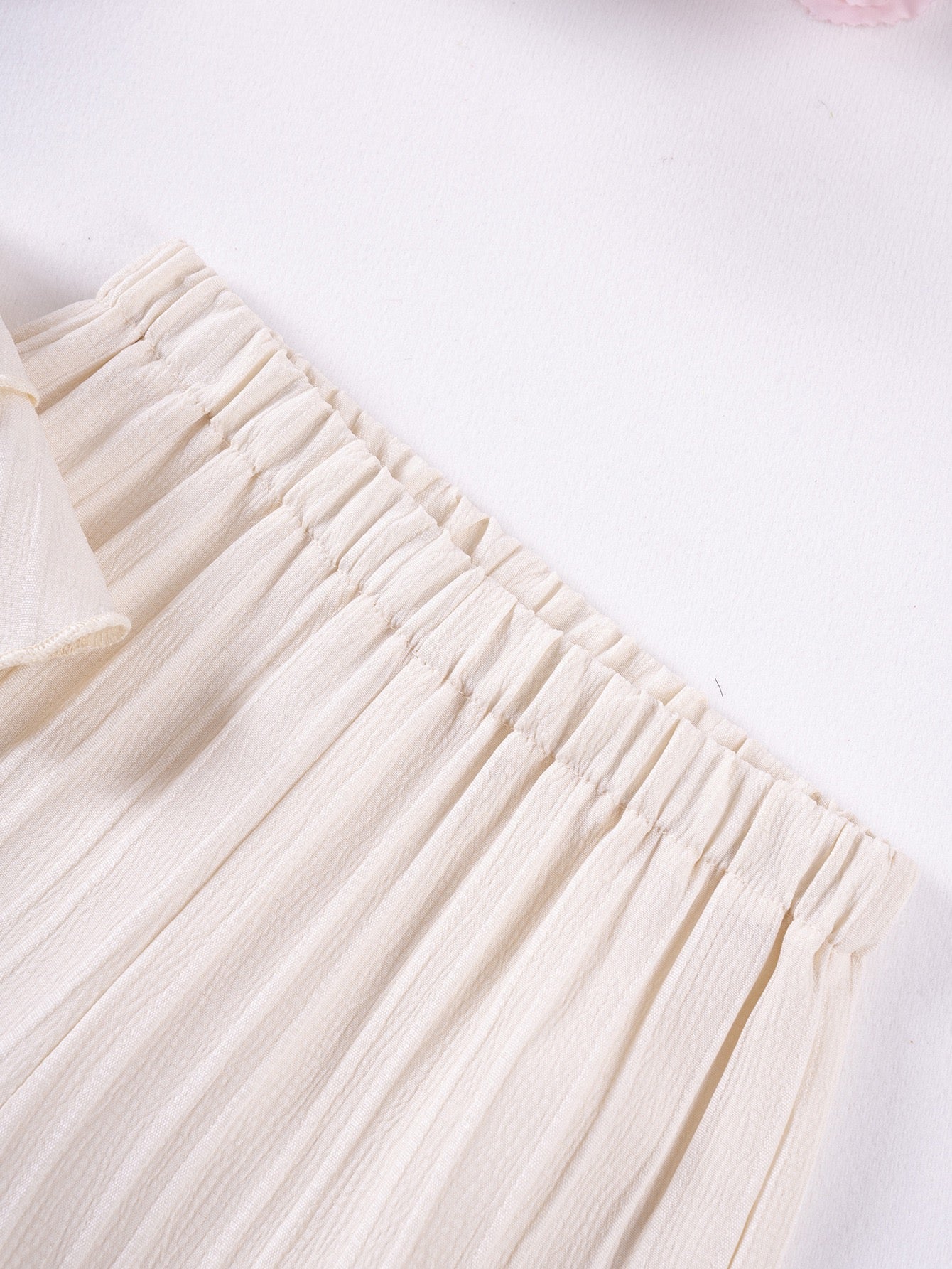 Elastic waist detail on Mila Breeze ivory cream wide-leg pants