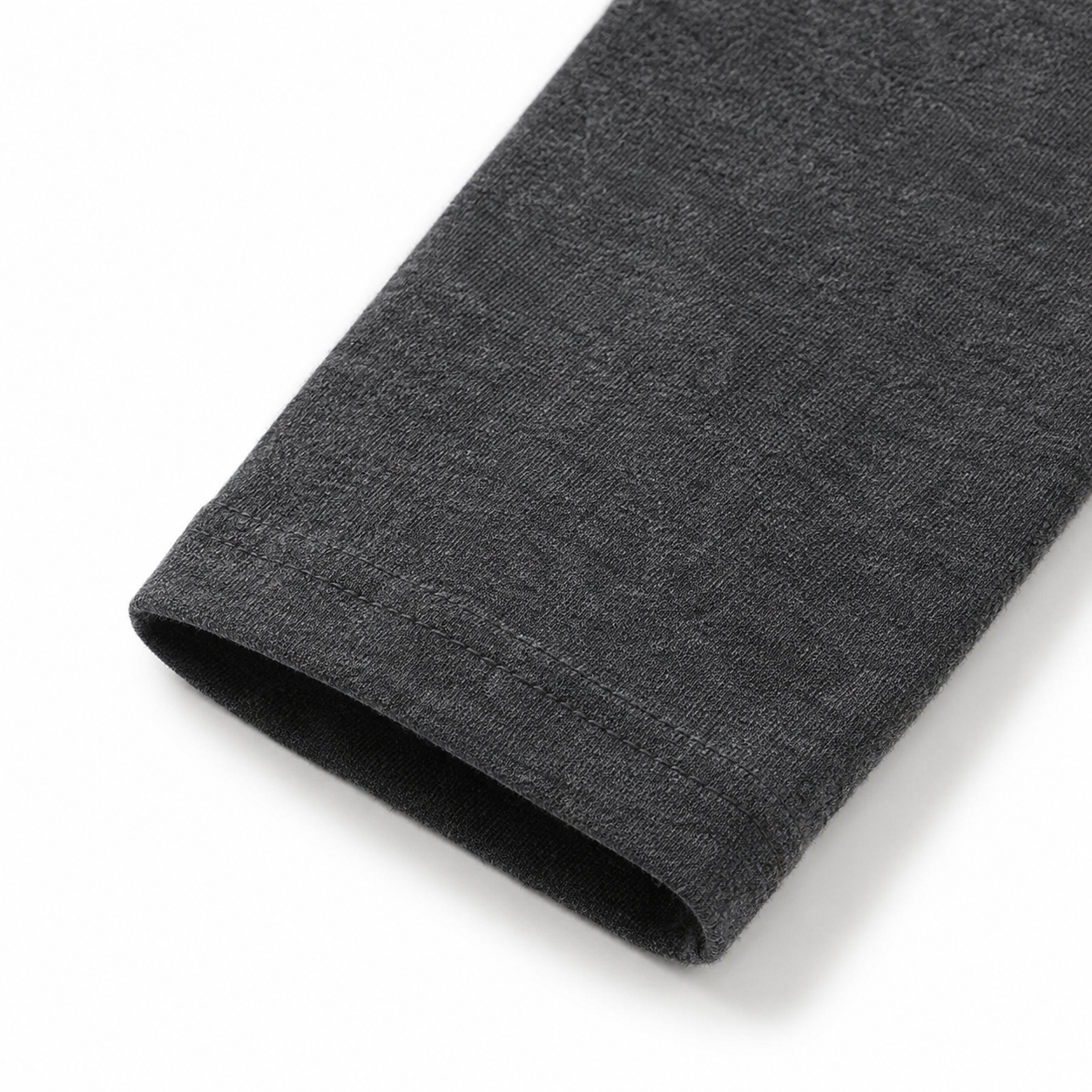 Close-up of the sleeve and cuff on the charcoal cotton long sleeve shirt for kids.