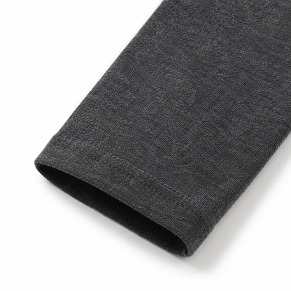 Close-up of the sleeve and cuff on the charcoal cotton long sleeve shirt for kids.