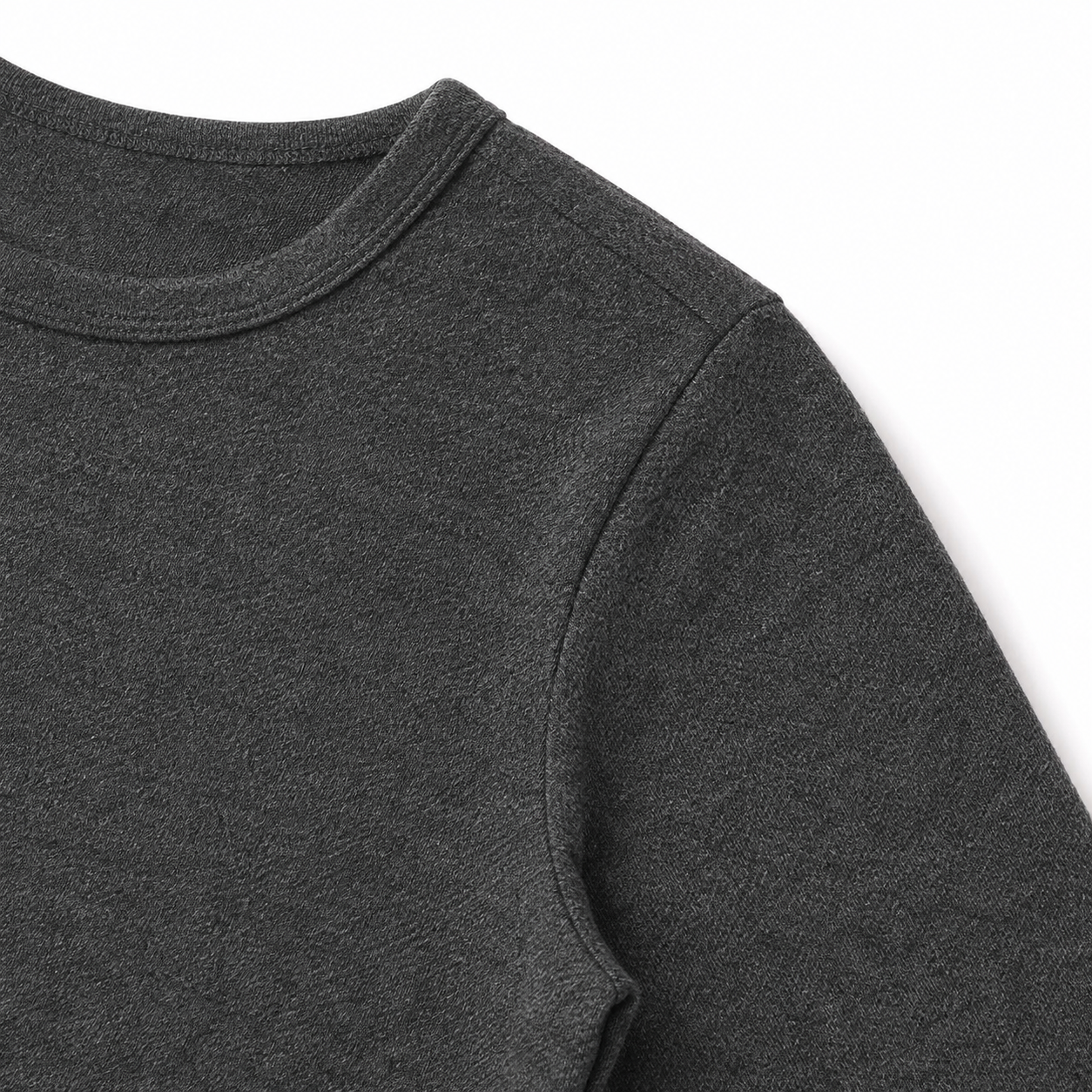 Close-up of the shoulder seam and cotton fabric on the charcoal kids tee.