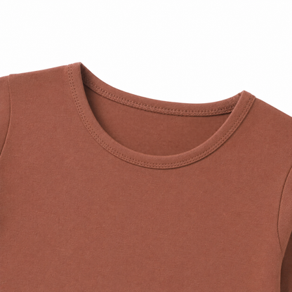 Close-up of the crew neckline on the terracotta kids long sleeve tee.