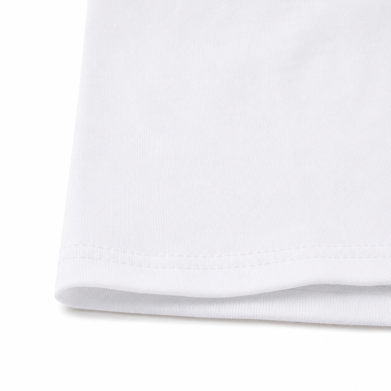 Close-up of the hem stitching and cotton fabric on the white long sleeve kids shirt.