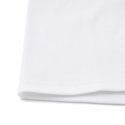 Close-up of the hem stitching and cotton fabric on the white long sleeve kids shirt.