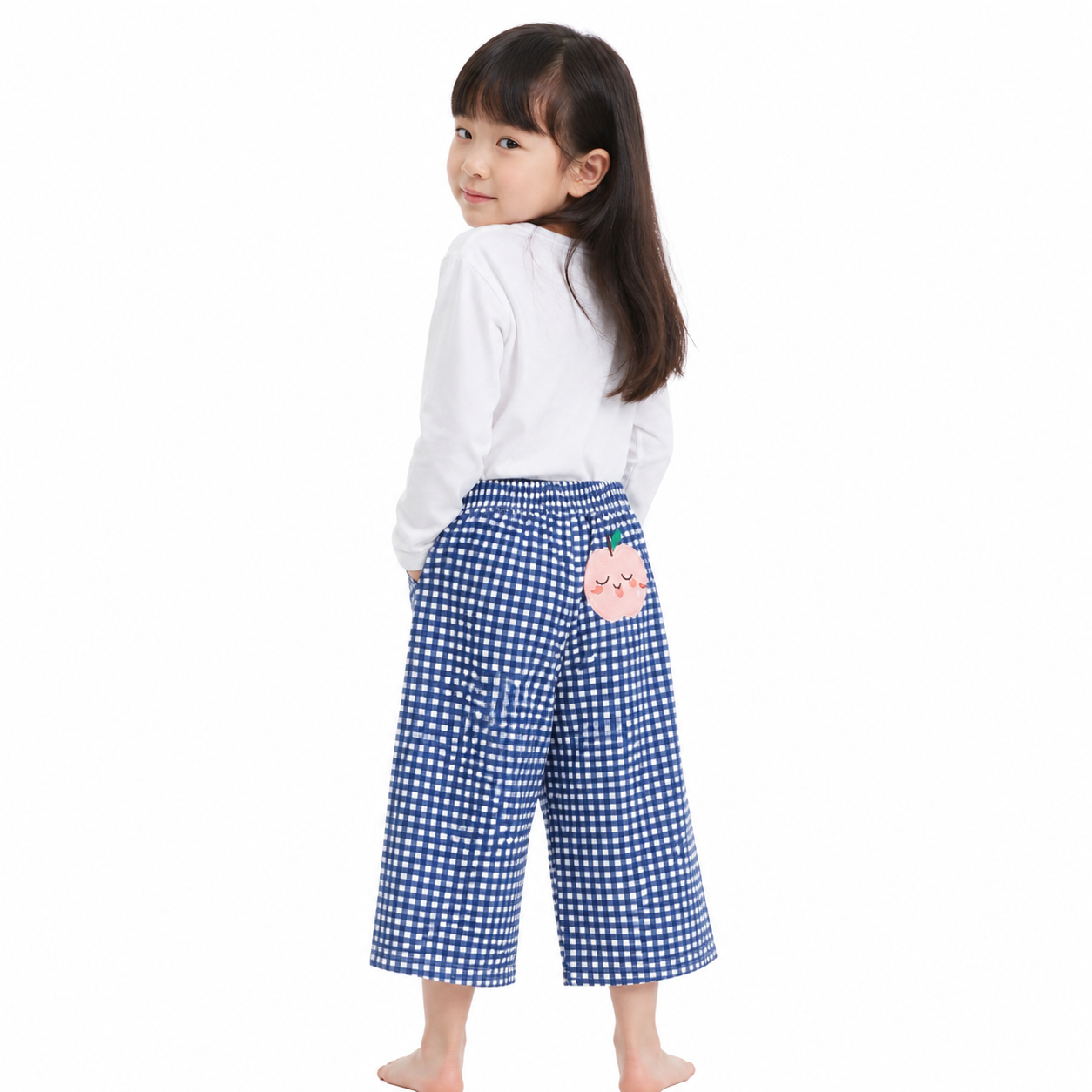 Girl model wearing blue gingham cotton pants with peach patch