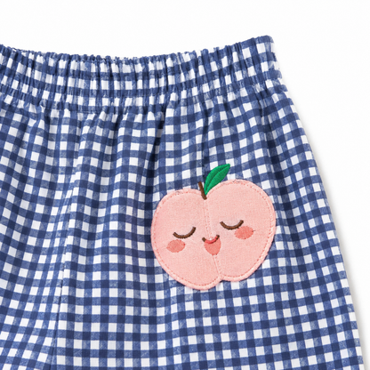 Blue gingham girls pants peach patch close-up