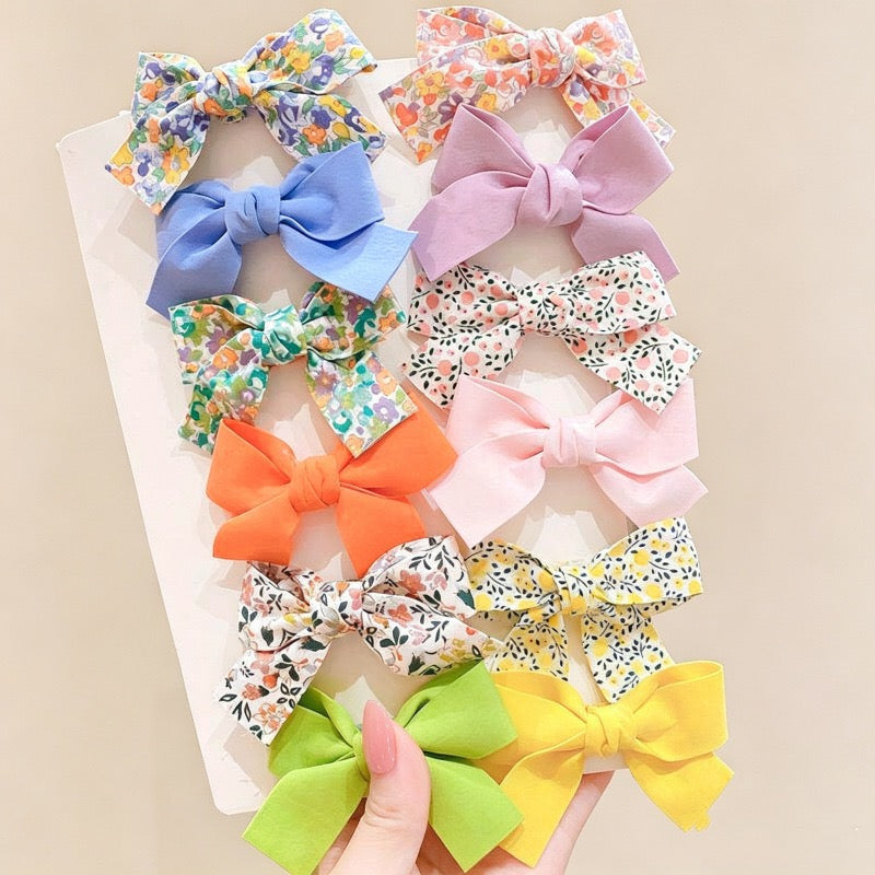 Petal Bloom Bow Clip Set with assorted floral and solid color bow hair clips.