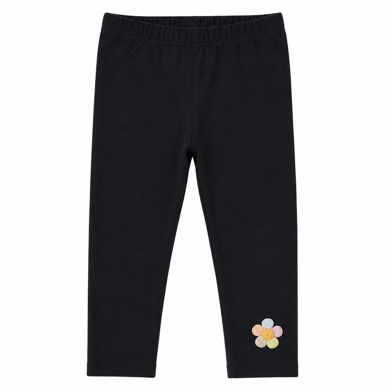 Front flat lay of the black girls cotton leggings with small flower detail near the hem.