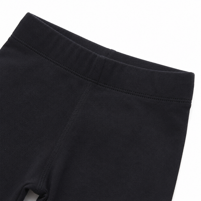 Close-up of the elastic waistband on the black girls leggings.