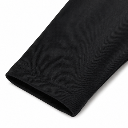 Close-up of the ankle hem and cotton fabric on the black girls leggings.