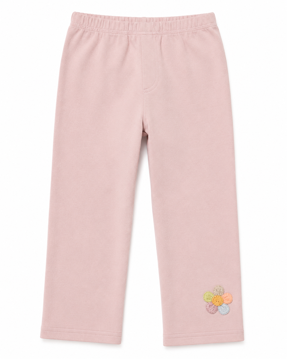 Front flat lay of the blush pink girls cotton leggings with small flower detail near the hem.