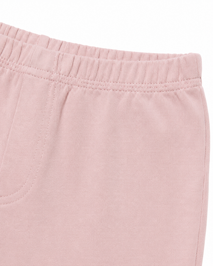 Close-up of the cotton fabric and seam detail on the blush pink leggings.