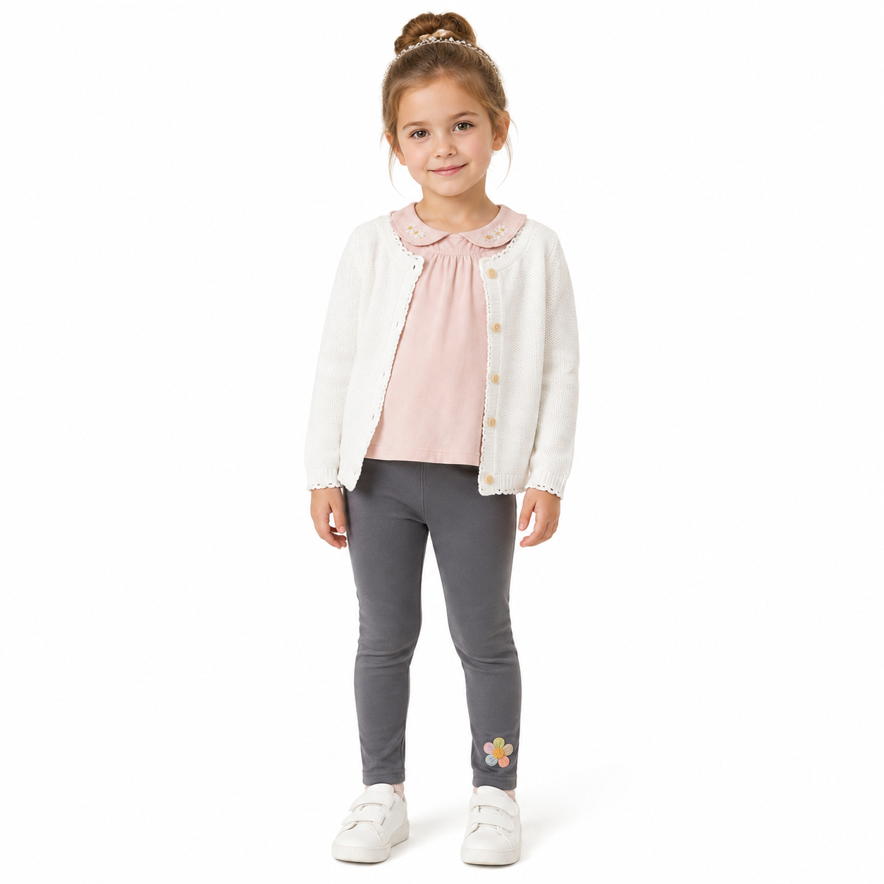 Girl model wearing the charcoal gray cotton leggings with a small flower detail near the ankle.