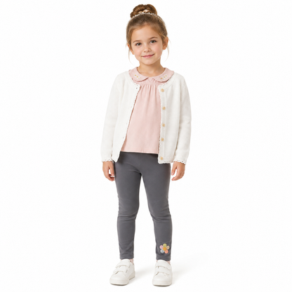 Girl model wearing the charcoal gray cotton leggings with a small flower detail near the ankle.