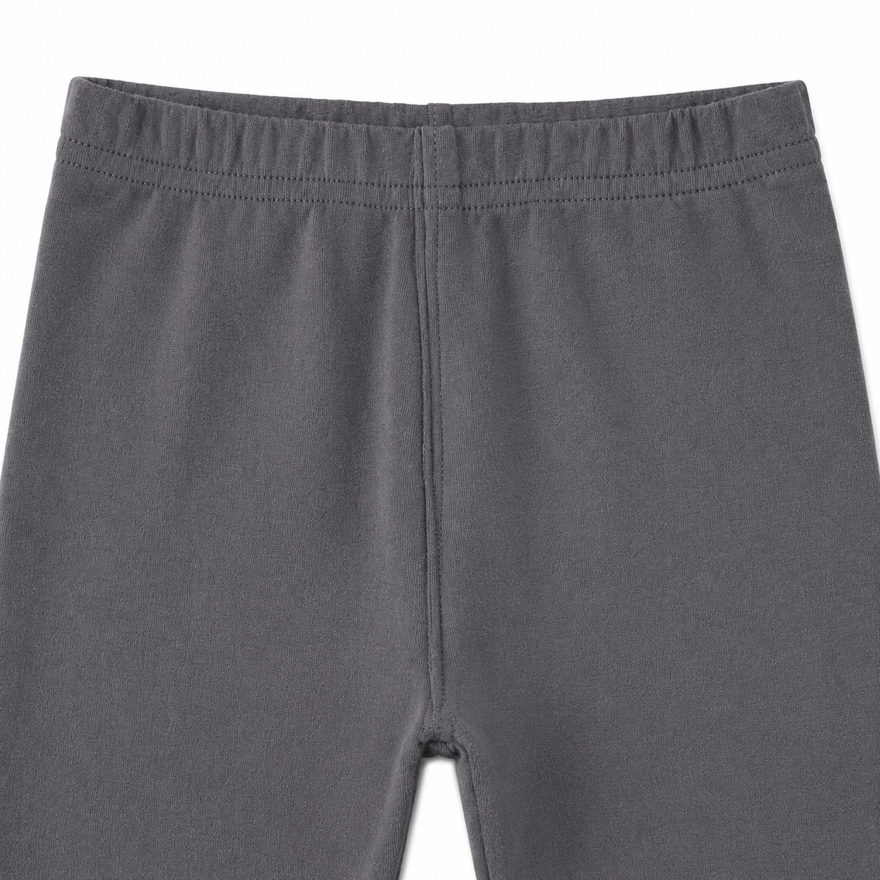 Close-up of the elastic waistband on the charcoal gray girls leggings.