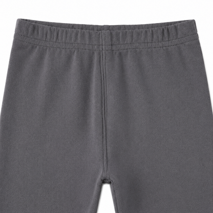 Close-up of the elastic waistband on the charcoal gray girls leggings.
