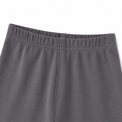 Close-up of the cotton fabric and seam detail on the charcoal gray leggings.
