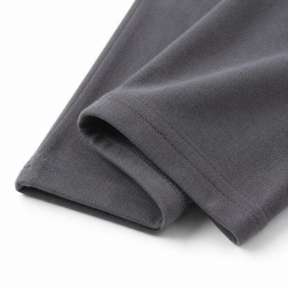 Close-up of the ankle hem and cotton fabric on the charcoal gray girls leggings.
