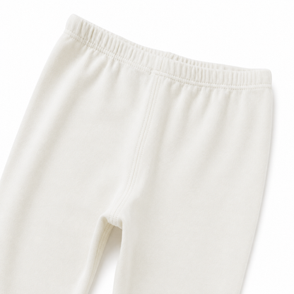 Close-up of the elastic waistband on the ivory girls leggings.