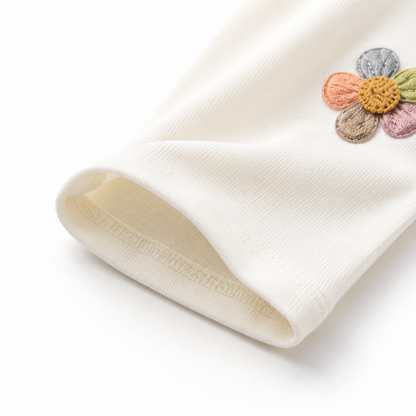 Close-up of the ankle hem and cotton fabric on the ivory girls leggings.
