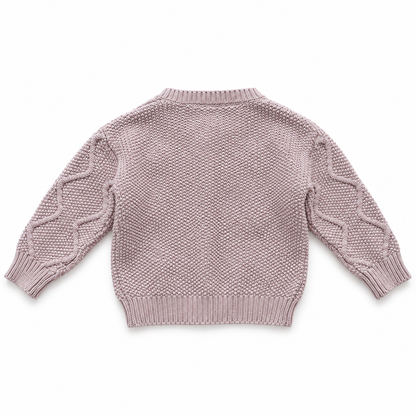 Back flat lay of the dusty mauve girls cable knit cardigan showing the knit texture and ribbed hem.