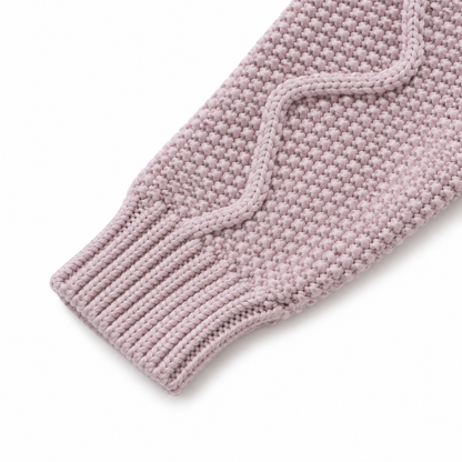 Close-up of the dusty mauve cardigan sleeve with cable knit texture and ribbed cuff.