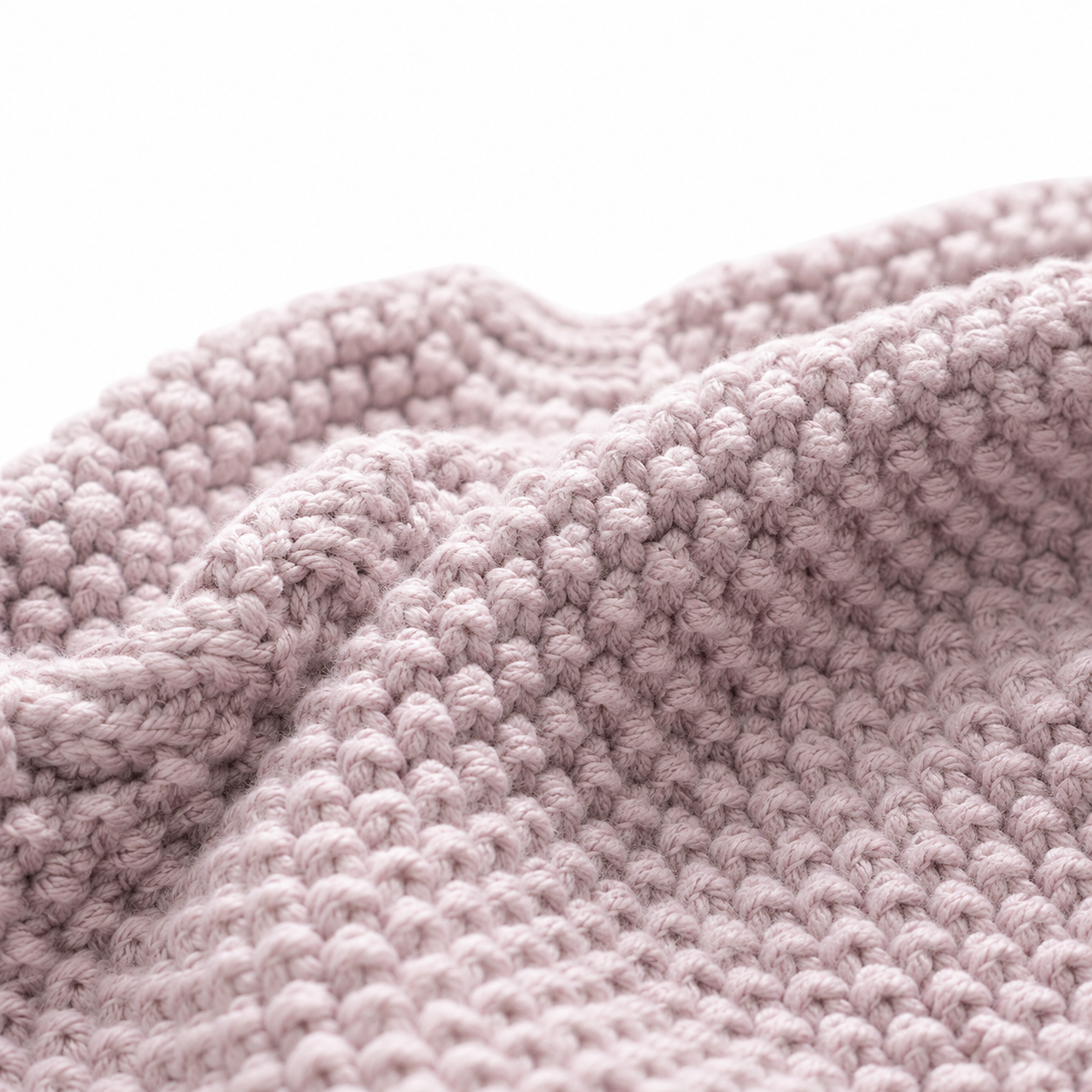 Close-up of the dusty mauve knitted fabric texture.