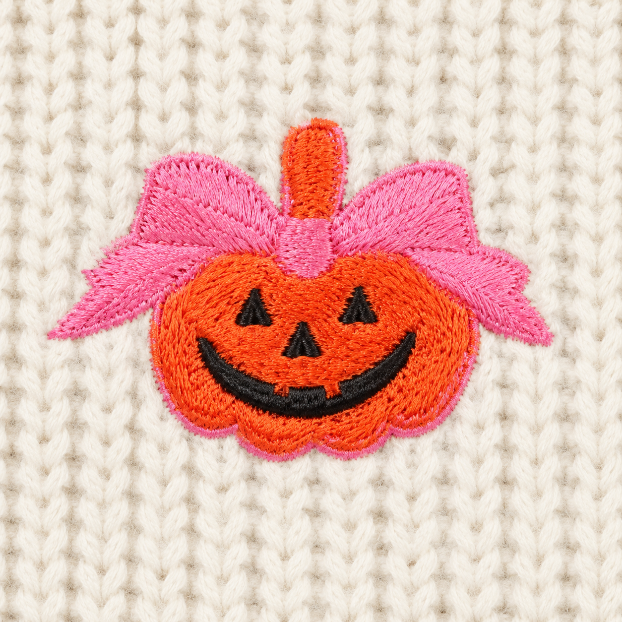 Pumpkin pattern detail on girls fall sweater