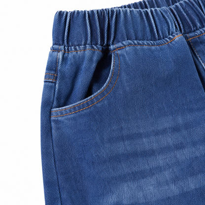 Close-up of the front pocket, waistband stitching, and faded denim detail.