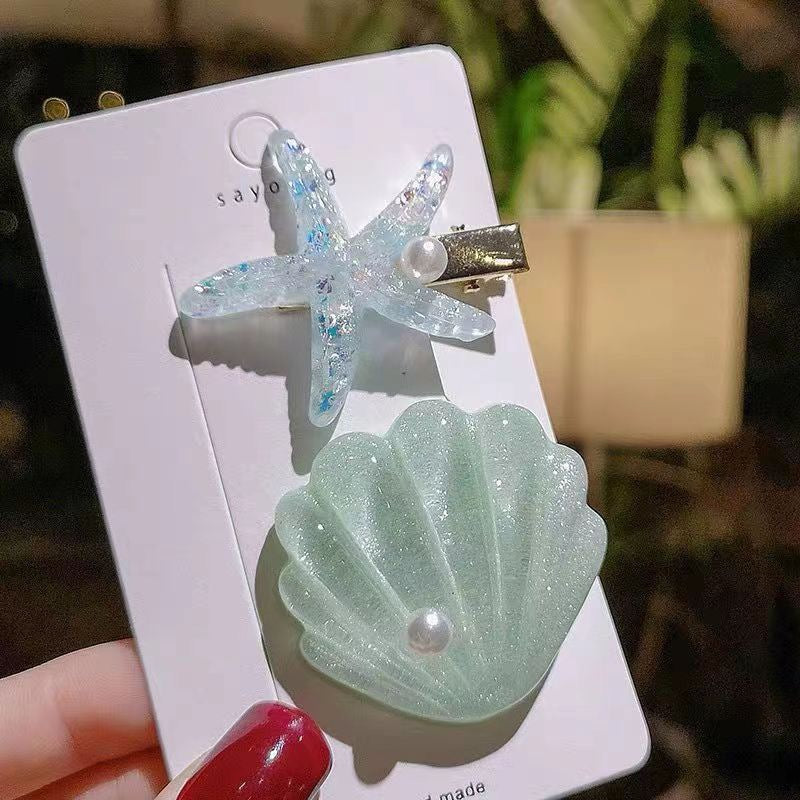 Mint Seaside Pearl Hair Clip Set with glitter seashell, clear starfish, and pearl accent.