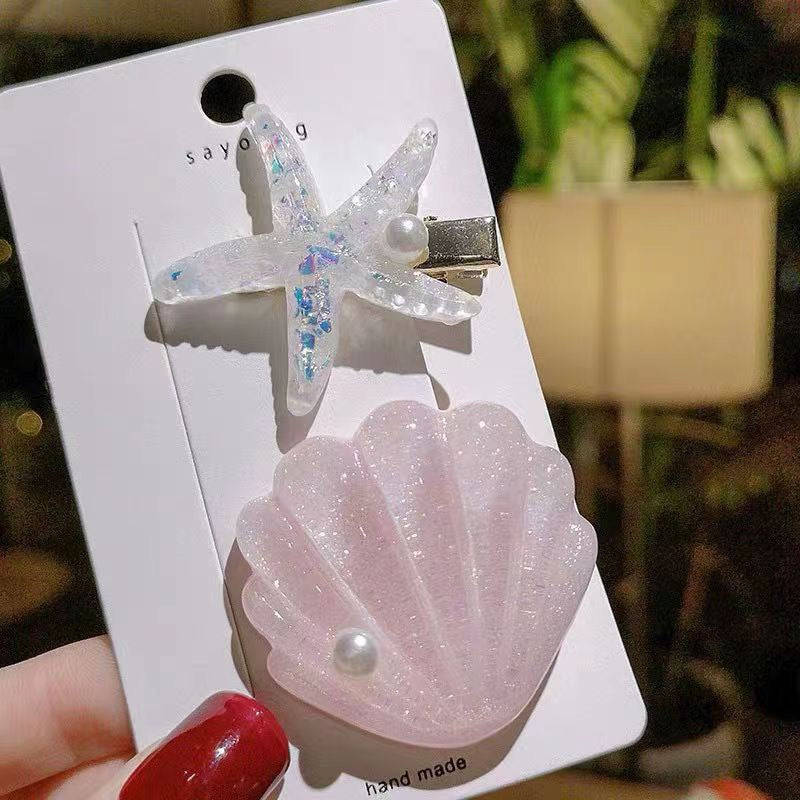 Pink Seaside Pearl Hair Clip Set with glitter shell, clear starfish, and pearl details.