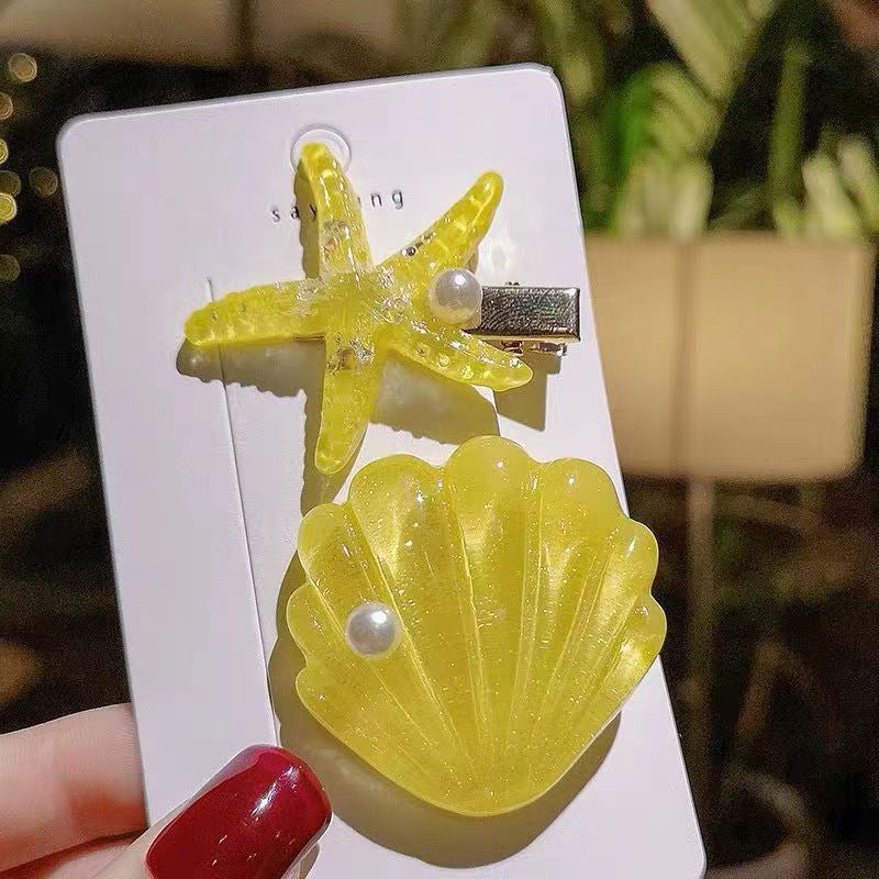 Yellow Seaside Pearl Hair Clip Set with glitter shell, starfish clip, and pearl detail.