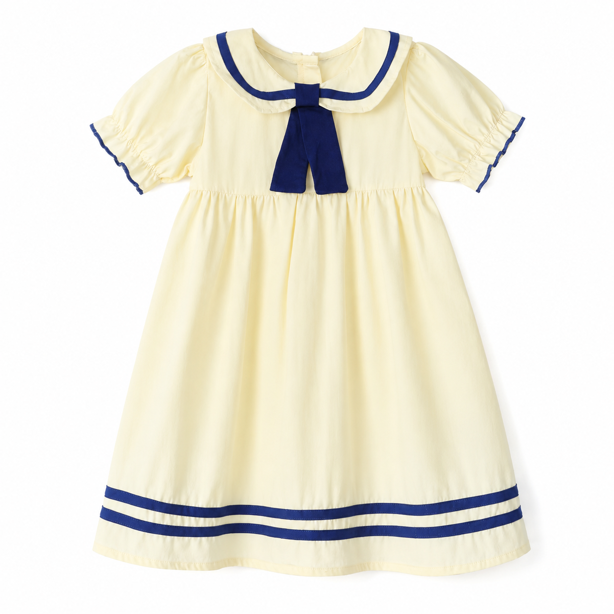Front flat lay of the ivory and navy girls cotton sailor dress with bow detail.