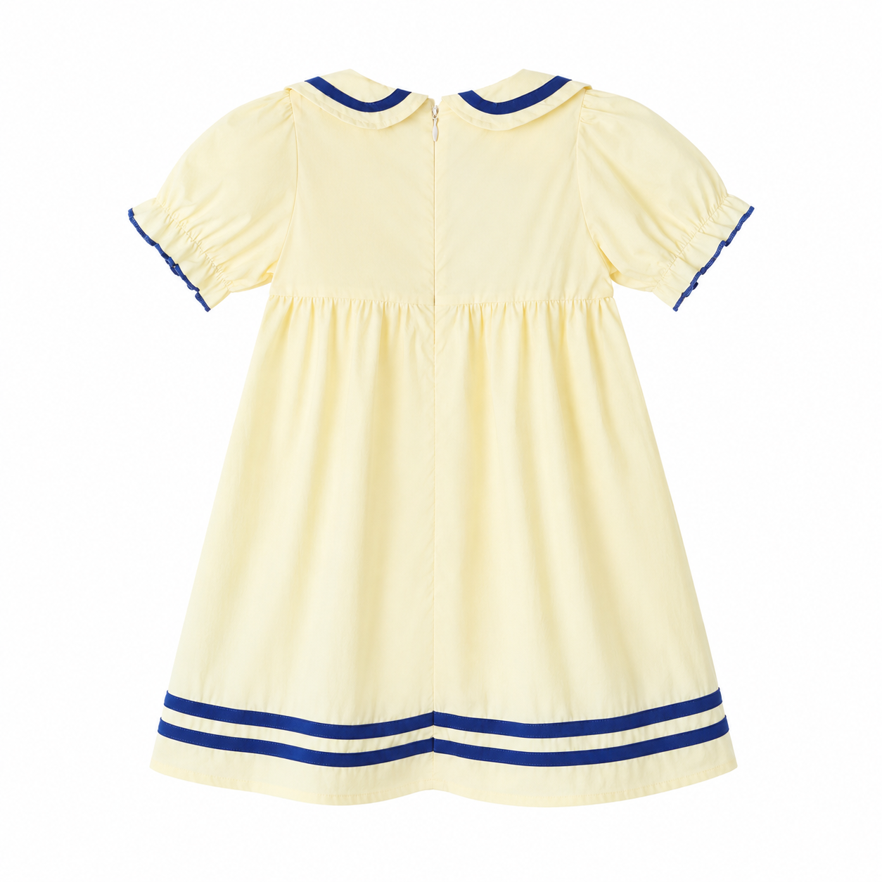 Back flat lay of the ivory and navy girls sailor dress.
