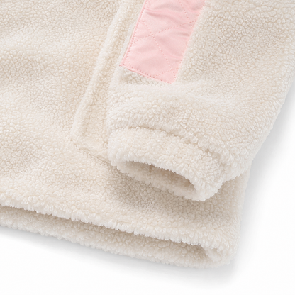 Close-up of the sleeve cuff, binding, and sherpa fleece texture.