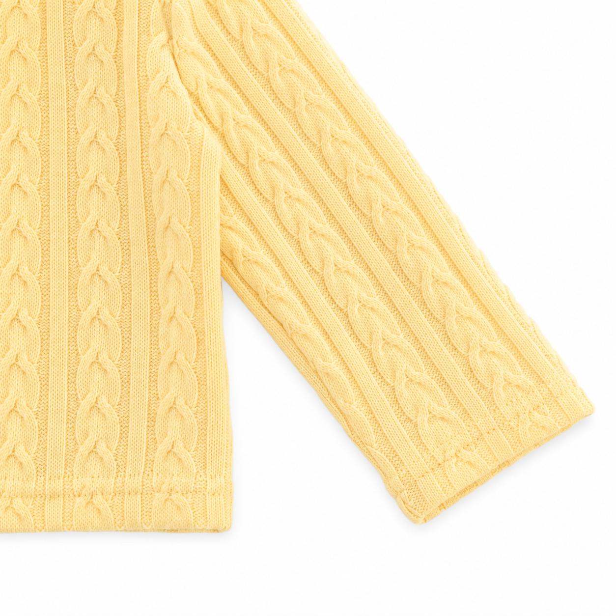 Close-up of the long sleeve and knit cuff on the Butter Yellow cardigan.
