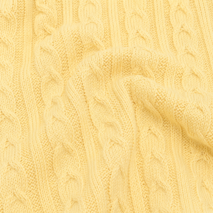 Close-up of the cable-knit cotton texture on the Butter Yellow cardigan.