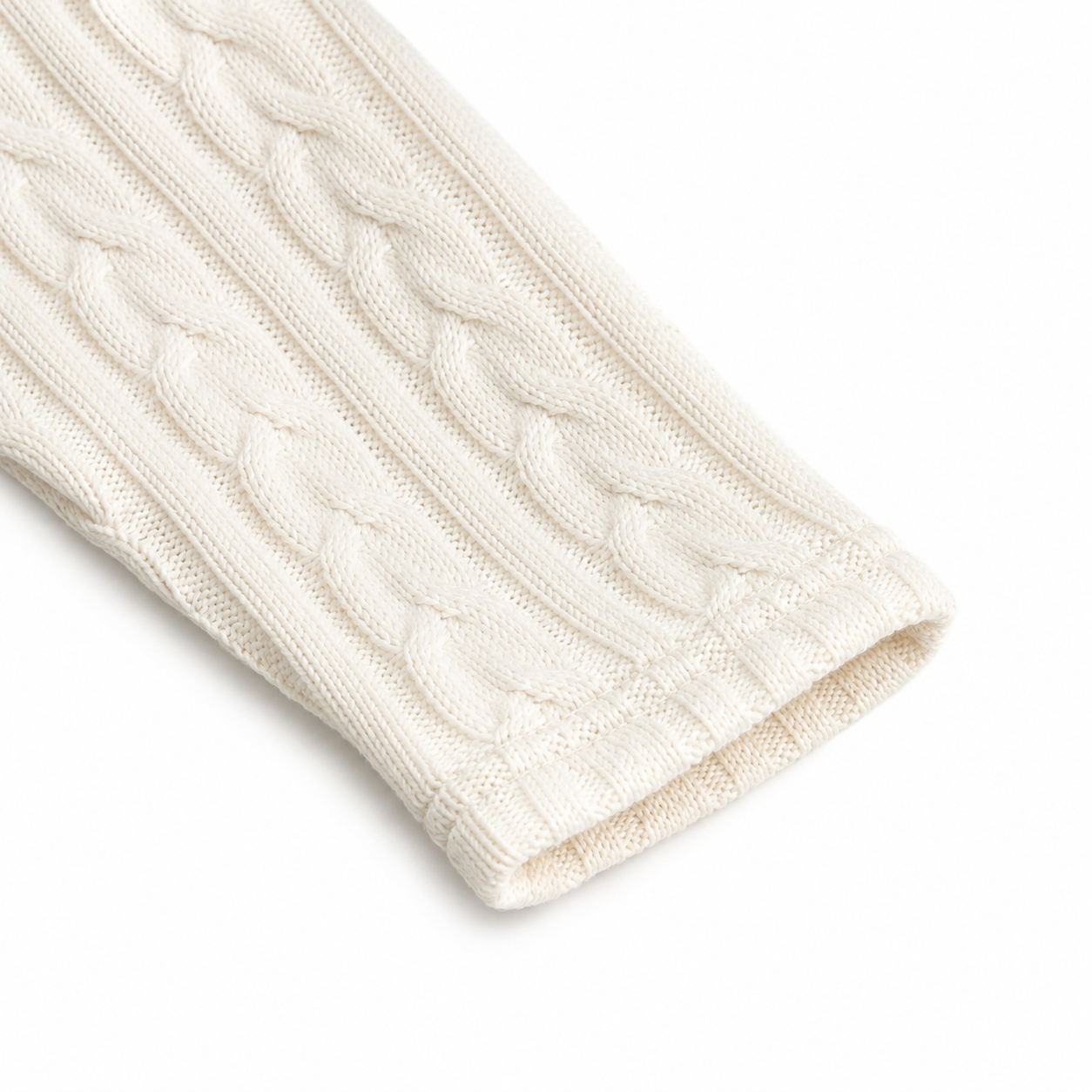 Close-up of the long sleeve and knit cuff on the Ivory cardigan.