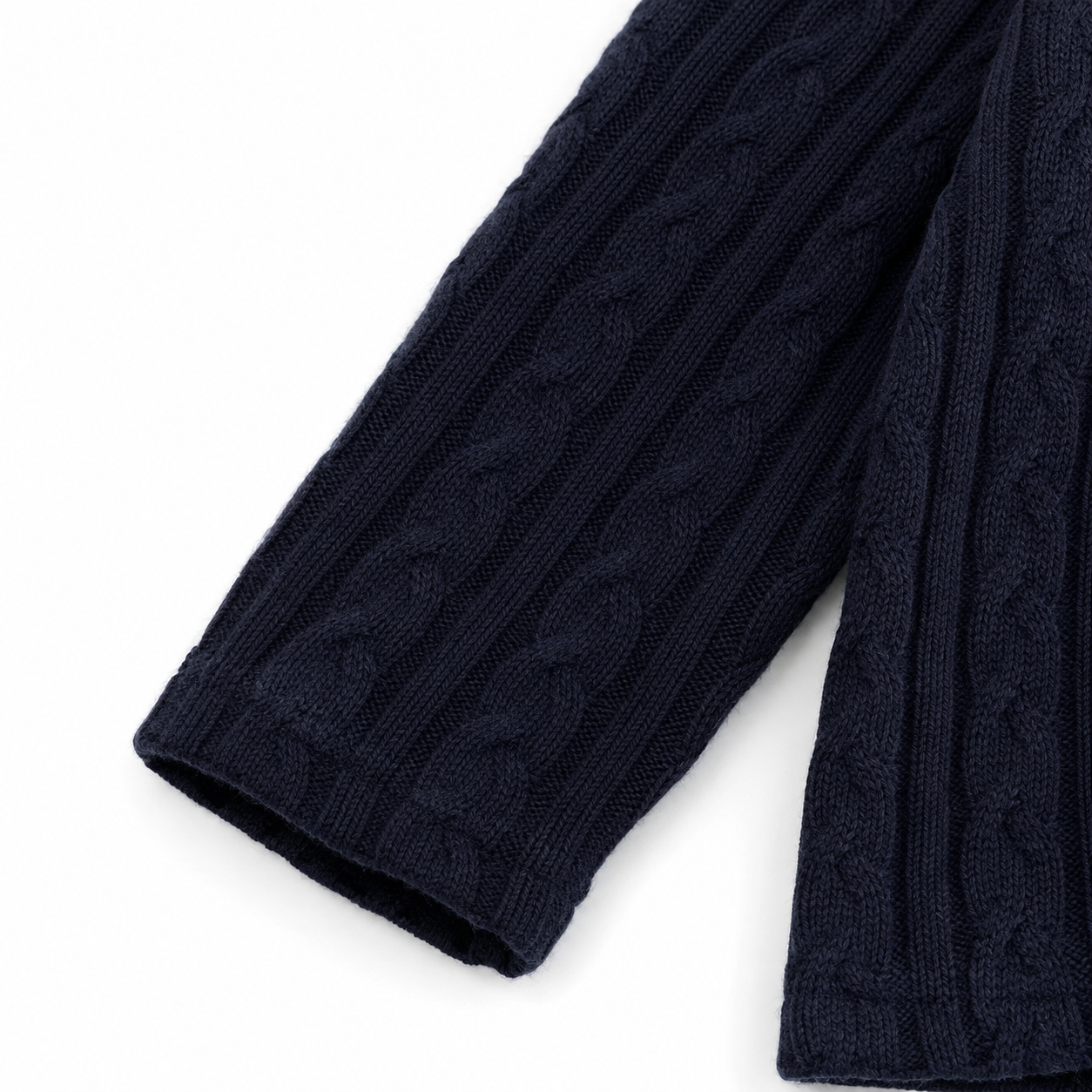 Close-up of the long sleeve and knit cuff on the Navy cardigan.