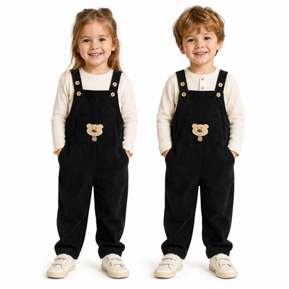 Girl and boy child models wearing the black kids corduroy bib overalls.
