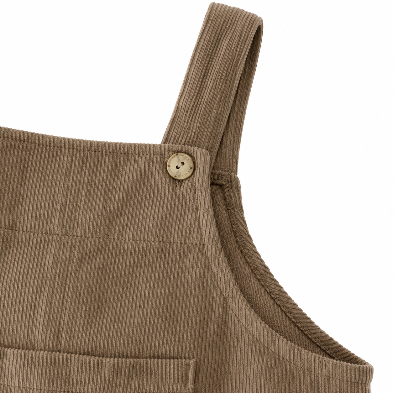 Close-up of the upper bib and side seam detail on the taupe overalls.