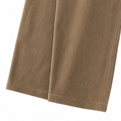 Close-up of the corduroy texture and pant leg hem on the taupe overalls.